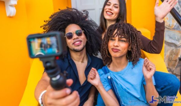 Social media influencers recording video content together