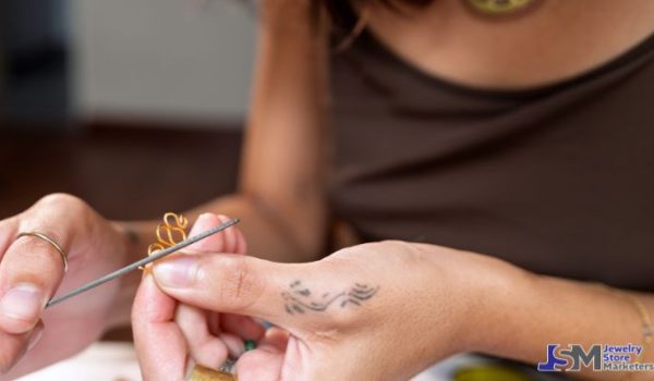 Jeweler carefully repairing a delicate gold jewelry piece