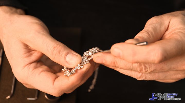 Jeweler inspecting diamond jewelry with precision tools